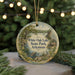 A decorative ornament featuring a scenic landscape of White Oak Lake State Park in Arkansas, with a lake, trees, and a cabin in the background.