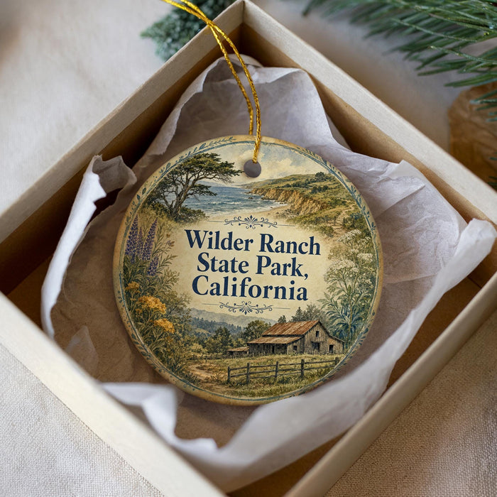 An ornament in a white box, featuring a scenic illustration of Wilder Ranch State Park, California.