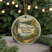 A round ornament with a scenic image of William Mitchell State Park, Michigan, hanging from a string.