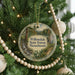 A round ornament on a Christmas tree, featuring a scenic image of Willowdale State Forest, Massachusetts.