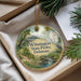 A decorative ornament with a scenic landscape of Wilmington State Parks, Delaware, featuring a bird, a bridge, and a river.