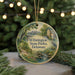 A round ornament with a painting of a scenic view of Wilmington State Parks, Delaware, featuring a bridge, trees, and a bird.