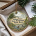 A decorative ornament with a scenic landscape of Wilson Island, Iowa, featuring a person kayaking on a river surrounded by trees and wildlife.