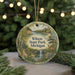A round ornament with a scenic landscape of Wilson State Park, Michigan, featuring a deer, a waterfall, and a forest.
