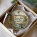 A decorative ornament in a box, featuring a scenic image of the Yampa River State Park in Colorado.