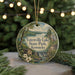 A round ornament with a scenic landscape of Yatesville Lake State Park, Kentucky, featuring a waterfall and a cabin, surrounded by pine trees and holiday lights.