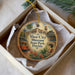 A circular ornament with a vintage-style illustration of a trolley car, palm trees, and a building, along with the text "Ybor City Museum State Park, Florida" and "7th Avenue Ybor".