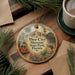 A circular ornament featuring a vintage-style illustration of a trolley car and palm trees, with the text "Ybor City Museum State Park, Florida" prominently displayed.