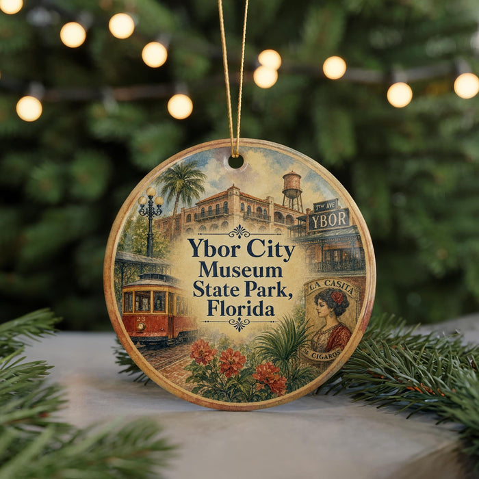 A circular ornament featuring an illustration of a trolley car and a building, with the text "Ybor City Museum State Park, Florida" prominently displayed.