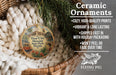 Ceramic ornaments, featuring a round ornament with a vintage-style illustration of a trolley car and palm trees, hanging from a wicker basket.