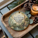 A decorative ornament with a vintage-style illustration of Yulee Sugar Mill ruins in Florida, surrounded by pine cones and a lit candle on a wooden tray.