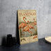 A vintage-style metal sign featuring an illustration of a flock of flamingos, with text that reads "American Flamingo Flock".