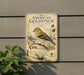 a vintage-style metal sign with an illustration of a goldfinch bird, mounted on a wall.