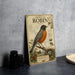 a vintage-style illustration of an American robin, with detailed illustrations of the bird, its nest, and surrounding foliage.