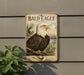 A metal sign featuring a bald eagle, with the text "BALD EAGLE PORTRAIT" prominently displayed.