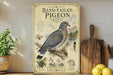 a vintage-style poster of a band-tailed pigeon, with illustrations of the bird, pine trees, and other natural elements. The poster is displayed on a wooden shelf, with a potted plant and a wooden cutting board visible in the background.