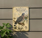 a vintage-style metal sign with illustrations and text about band-tailed pigeons, mounted on a wall next to a plant.