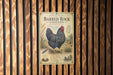 a vintage advertisement for Barred Rock Chicken, which is a specialty breed known for its distinctive appearance and taste.