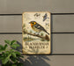 a vintage-style metal sign with illustrations and text about the Blackburnian Warbler, a bird species native to North America.