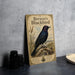 A vintage-style poster of Brewer's Blackbird, featuring a detailed illustration of the bird perched on a branch with berries and grasses.