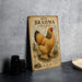 a vintage-style metal sign with an illustration of a large chicken, placed on a countertop next to some black camera lenses.