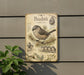 a vintage-style metal plaque with illustrations and text about a small bird, specifically a bush tit, perched on a branch.