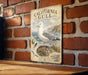 a vintage-style metal sign with a seagull illustration, mounted on a brick wall.