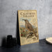 A vintage-style metal sign featuring an illustration of a California thrush bird, with text describing the bird and its habitat.