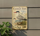 a vintage-style metal plaque depicting a Caspian Tern, a large seabird, with a detailed illustration of the bird and its natural habitat.