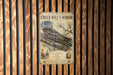 A poster of a woodpecker is displayed on a wooden wall, with a bird illustration and text.