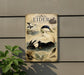 a vintage-style metal sign with illustrations of ducks and other birds, mounted on a wall next to a plant.
