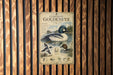 a vintage-style metal sign with illustrations and text about the Common Goldeneye, a type of duck.