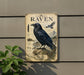 a vintage-style sign with a black raven illustration, mounted on a wall.
