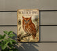 a vintage-style metal sign with an illustration of an owl perched on a branch, mounted on a wall.