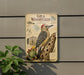 A metal sign with illustrations and text about the Gila Woodpecker, a species of bird, mounted on a wall.