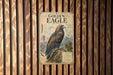 a poster of a golden eagle, which is a large bird of prey native to North America.