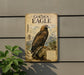 a vintage-style metal sign with a depiction of a golden eagle, mounted on a wall.