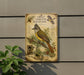 a vintage-style metal plaque with illustrations and text about the Great Crested Flycatcher, a bird species.