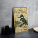 A vintage-style metal sign featuring an illustration of a green kingfisher bird, with text indicating it is from the National Library of the United States.