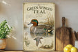 The image is a framed poster of a green-winged teal duck, featuring illustrations and text about the species.