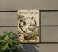 a vintage-style sign for Houdan chicken, mounted on a wall next to a plant.
