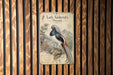 a vintage-style illustration of a colorful bird, likely a pheasant, perched on a branch.