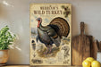 a vintage-style poster of a wild turkey, with illustrations and text about the bird, displayed on a shelf next to a wooden cutting board and some potted plants.