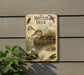 a vintage-style metal plaque with illustrations and text about ducks, mounted on a wall next to a plant.