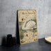 a vintage-style illustration of a swan, with accompanying text and illustrations, displayed on a wall.