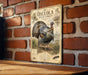 A metal sign with a turkey illustration and text is mounted on a brick wall.