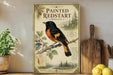 a vintage-style poster of a painted redstart bird on a branch, surrounded by illustrations of pine trees and berries.