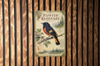 a poster of a painted redstart bird perched on a branch, with a map and text below it.