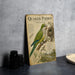a vintage-style educational poster about Quaker Parrots, with a detailed illustration of the bird and its natural habitat.