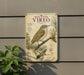 a vintage-style metal sign with illustrations and text about the Red-eyed Vireo, a bird species.
